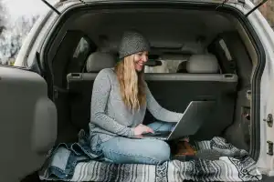 On the road with a dead laptop? Your car can charge it!